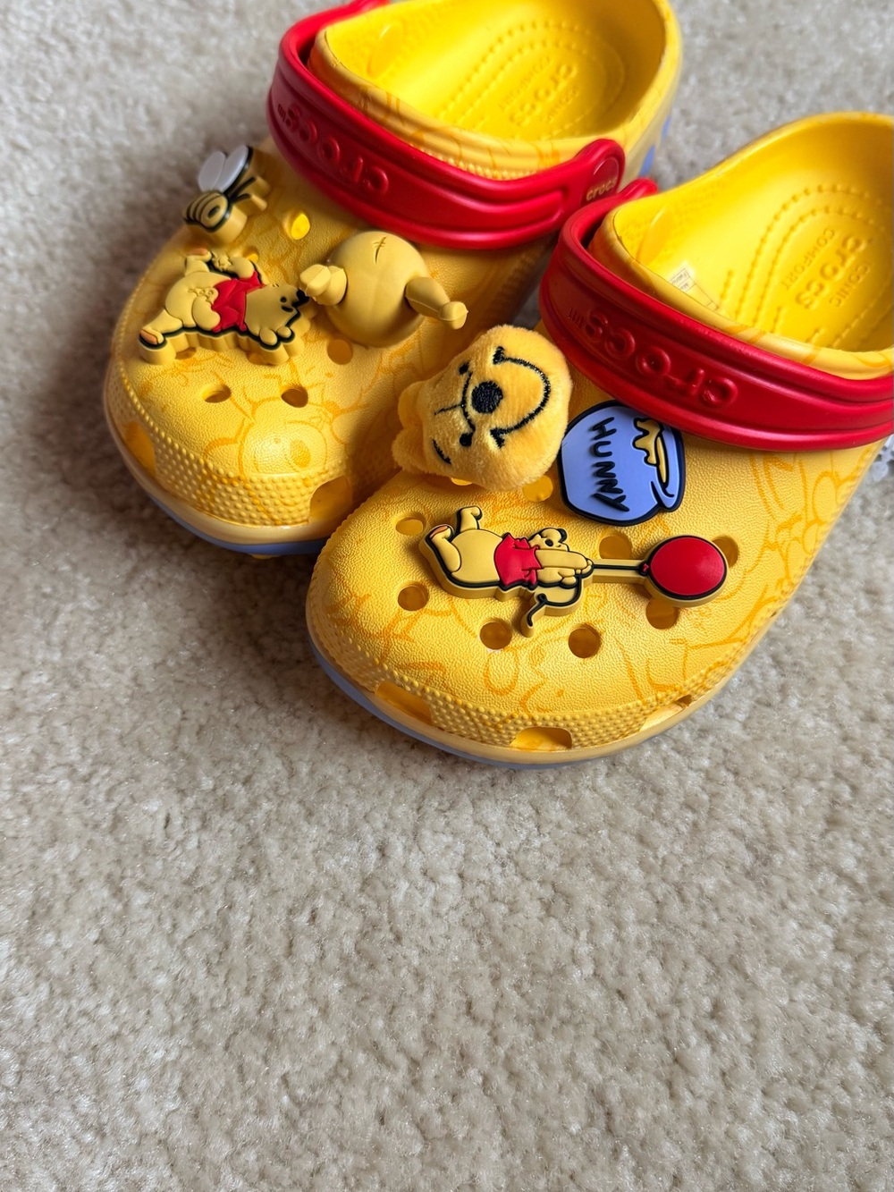 CROCS Kids Yellow Clog with Red Heel Strap - Winnie the Pooh Charms